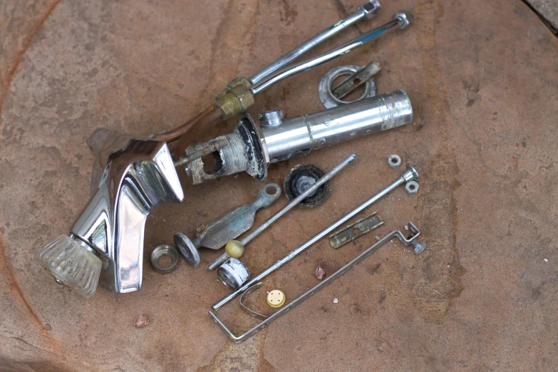 a couple of wrenches, nuts and other metal objects