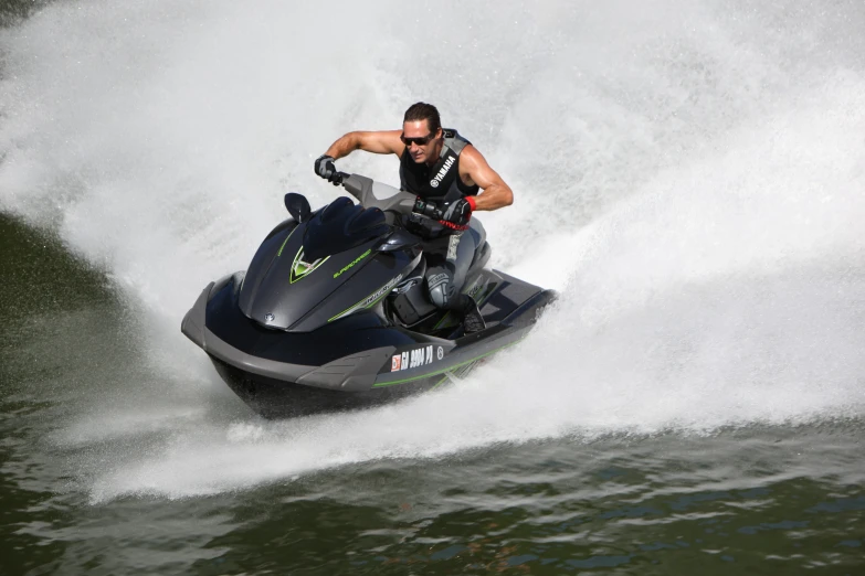 a man on a jet ski riding in the water