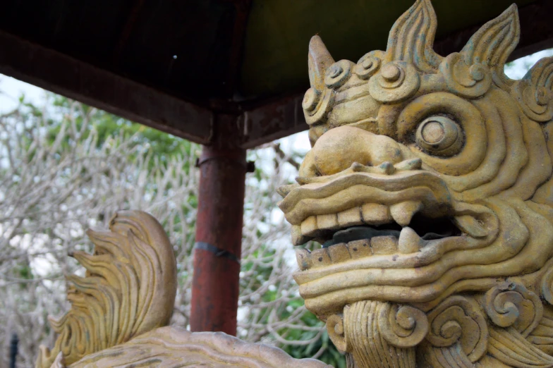 a stone dragon statue with his eyes wide open