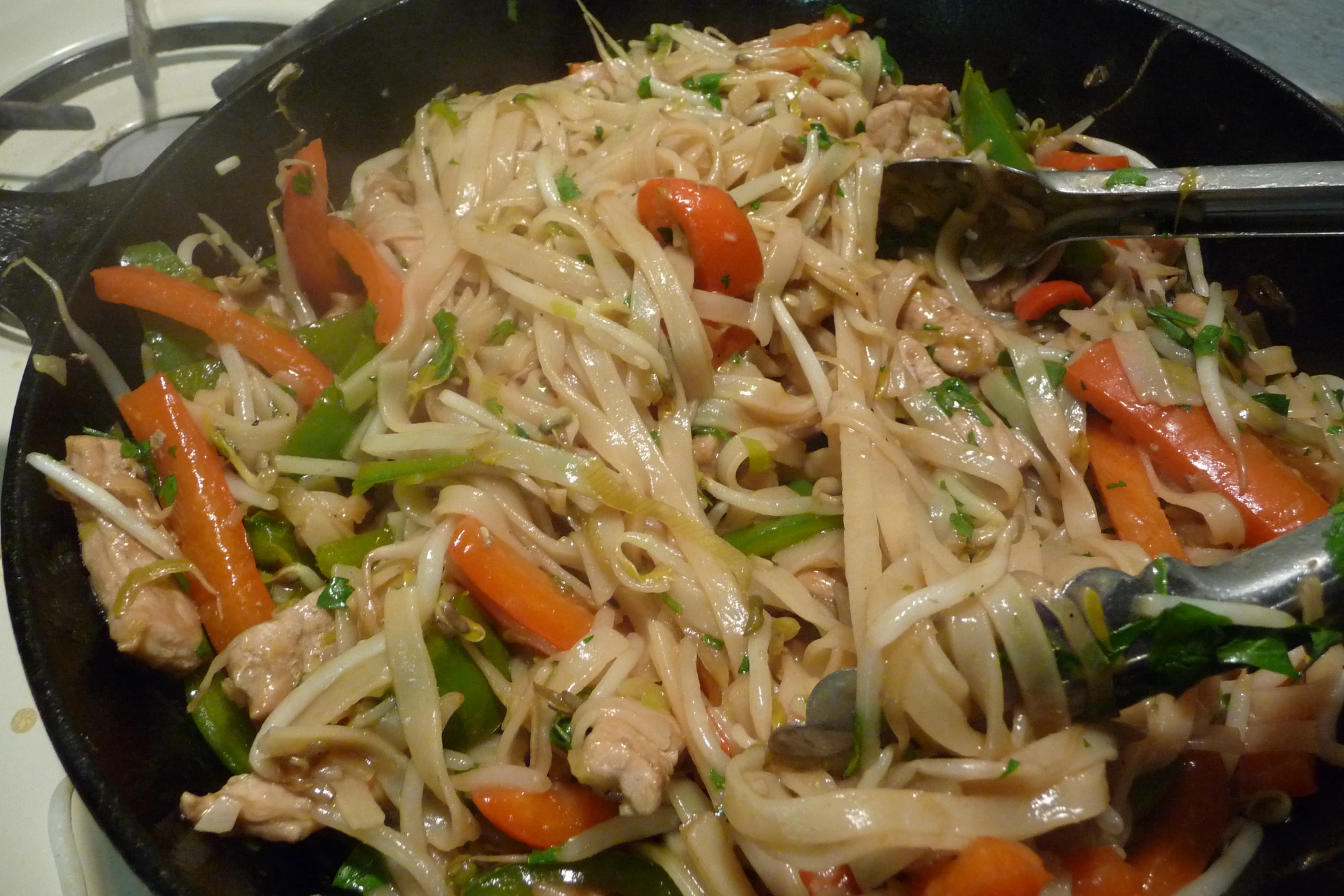 vegetable dish being served in large set on stove