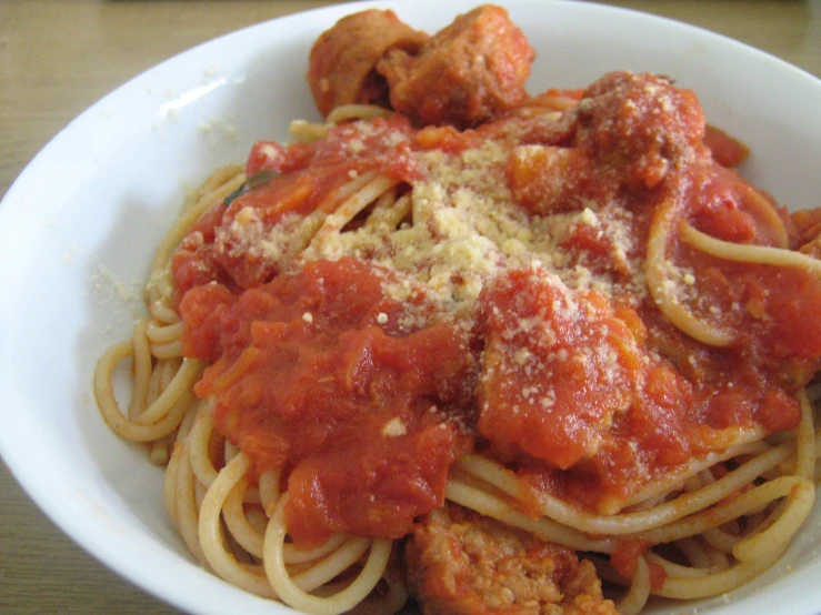 the pasta dish has meatballs and sauce