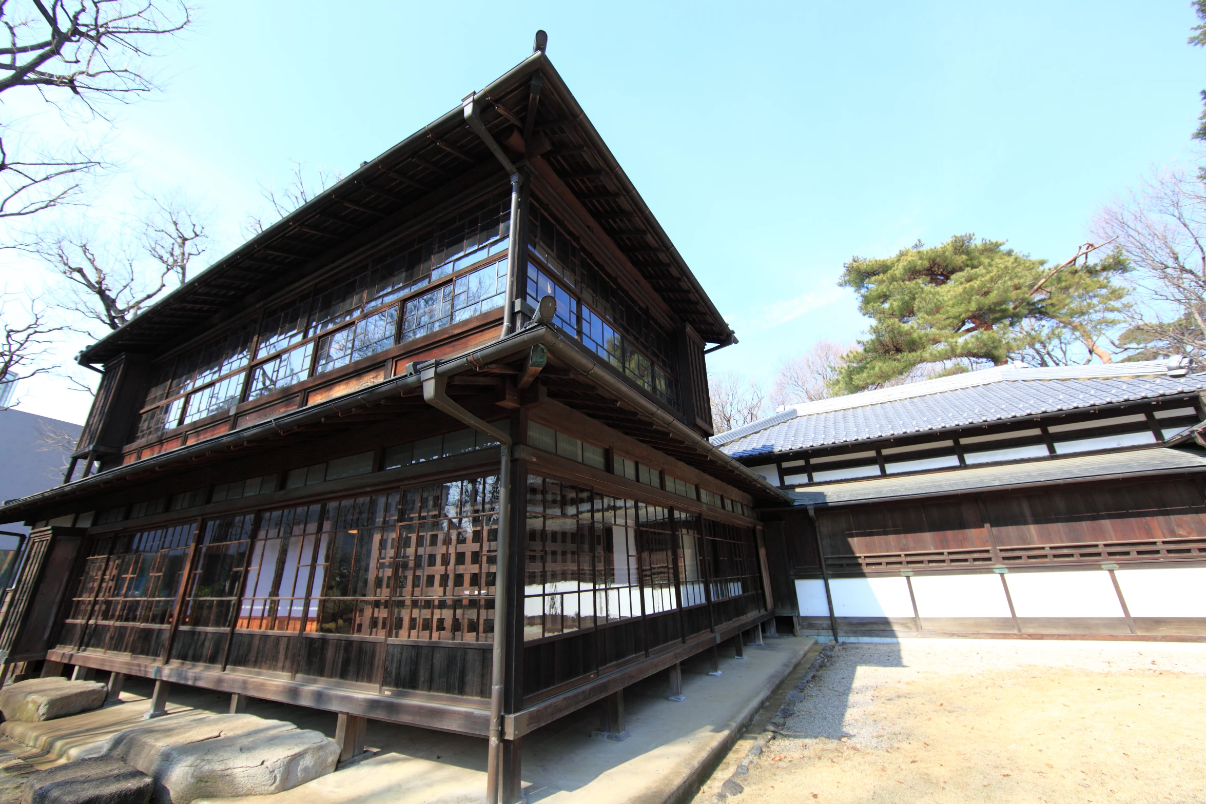 an old, rustic wooden building stands empty