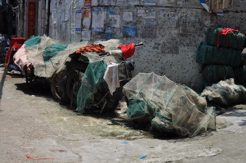 a truck pulling a pile of fishing nets on the street