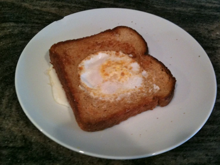 two slices of toast with an egg in the middle
