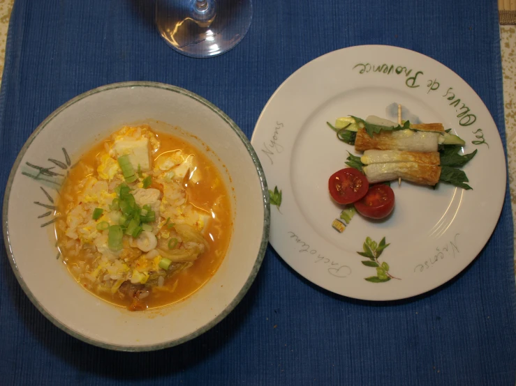 the plate on the table has an egg and vegetable dish in it