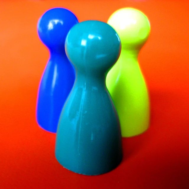 some small plastic toys on a colored background