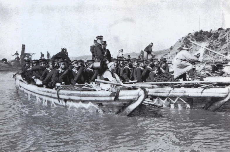 the group is sitting on the raft in the water