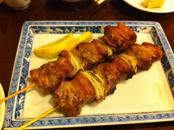 food being displayed on a plate, which includes chicken and potatoes