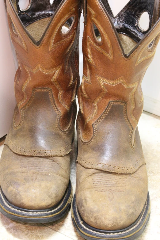 a pair of cowboy boots that are worn