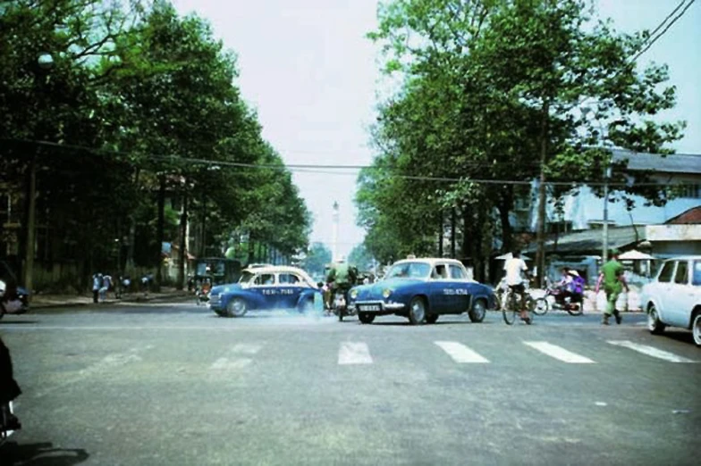 the traffic is stopped in front of two police cars