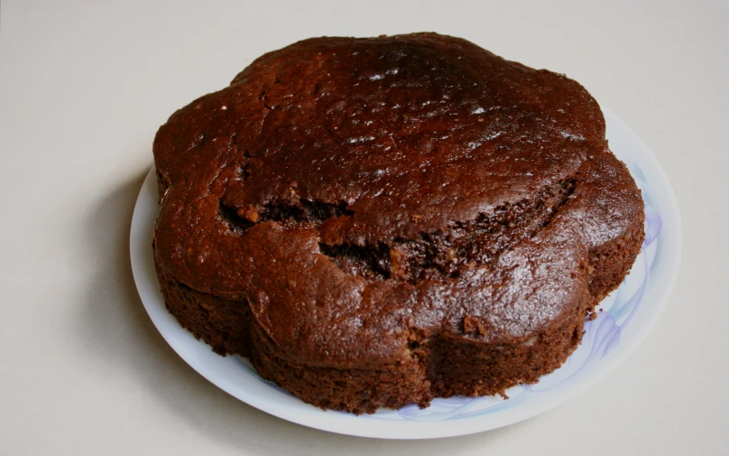 a piece of chocolate cake on top of a white plate