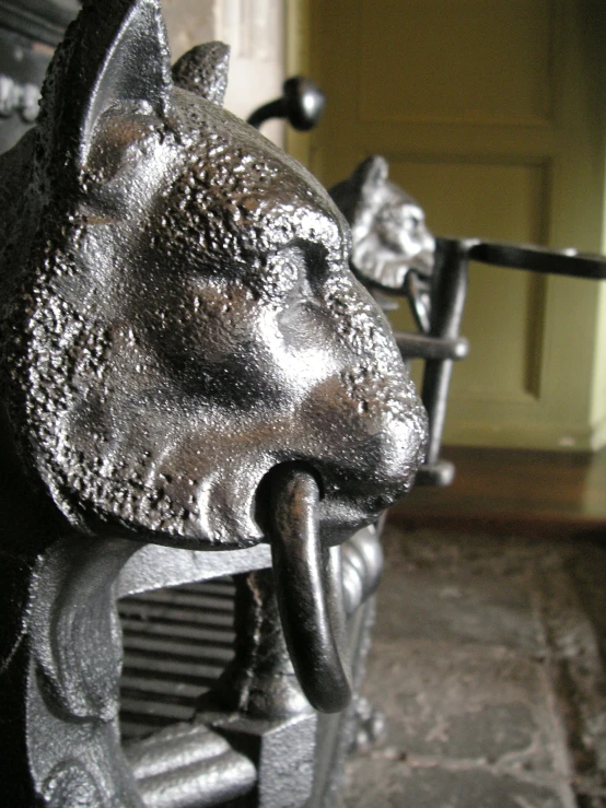 an image of a silver statue with its mouth open