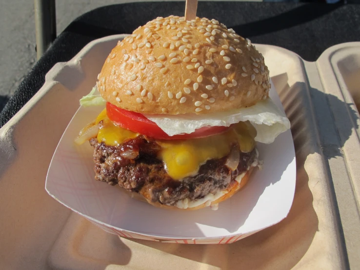 a hamburger on a plate that is being served