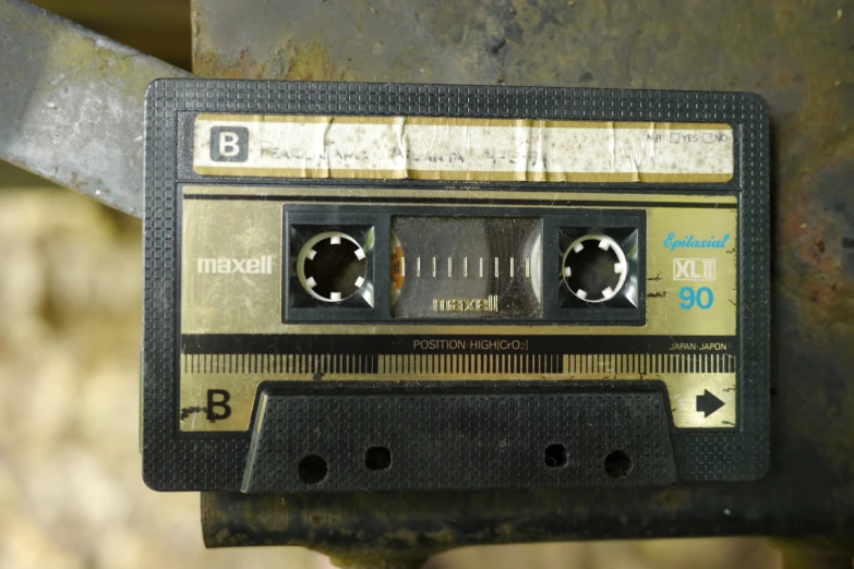 an old cassette player with metal trim and holes