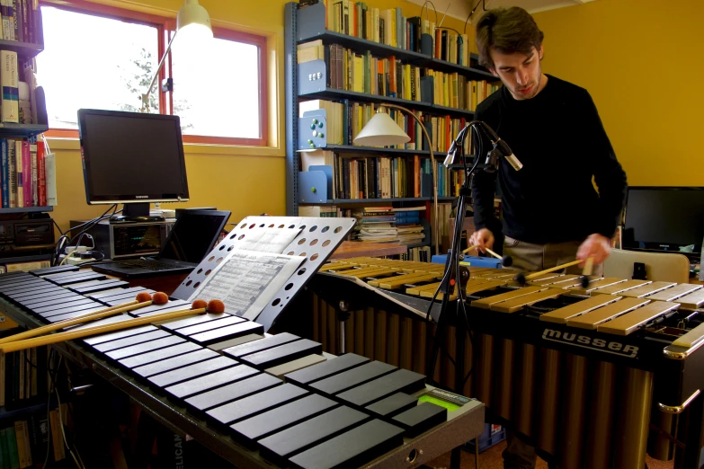 a man playing a set up in front of drums