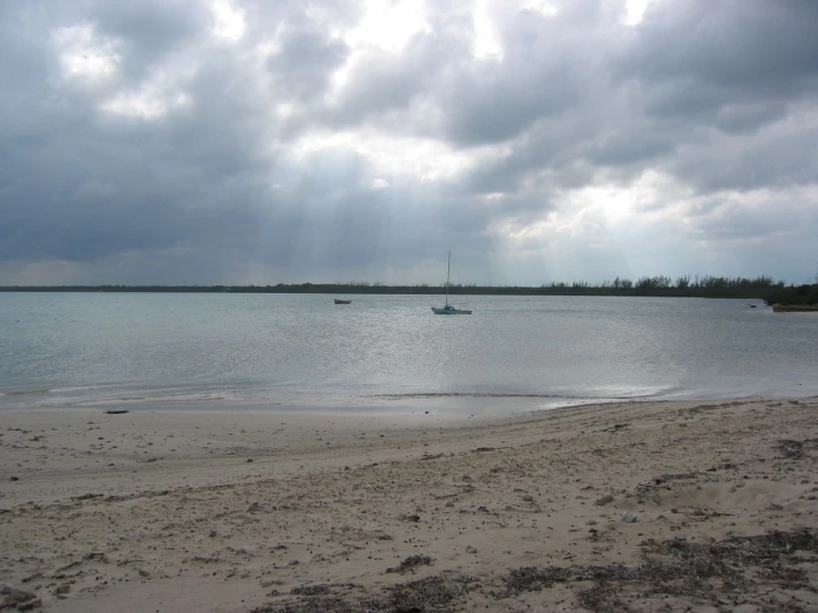 boats in the water during a very cloudy day