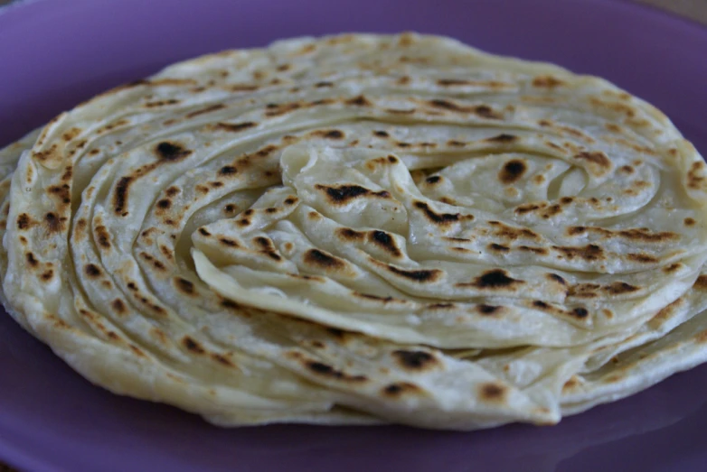 an image of flat bread rolls stacked on top of each other