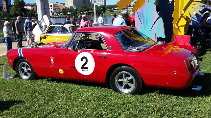 vintage sports car at a car show at a theme park