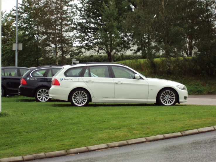 a car parked on a grass covered driveway