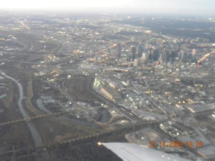 view from a plane looking down on some city at night