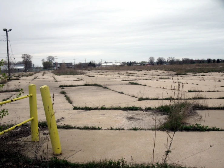 the parking lot in the middle of the field is empty