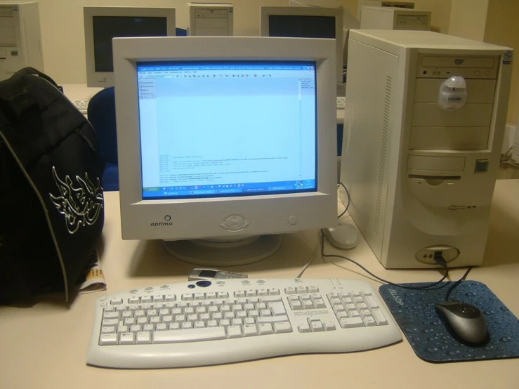 a desktop computer is on a cluttered desk
