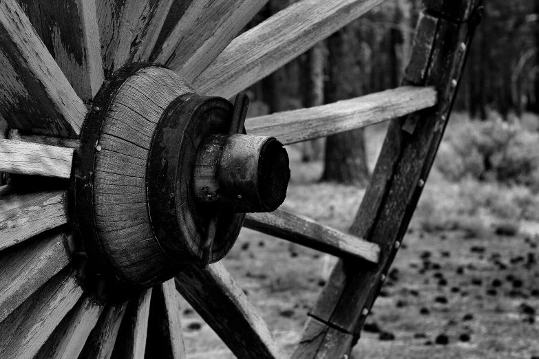 a black and white po of an old wagon wheel