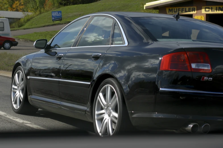 the rear end of an elegantly shaped car