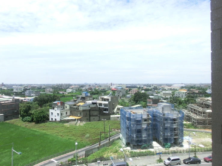 a picture of a city with green grass on it