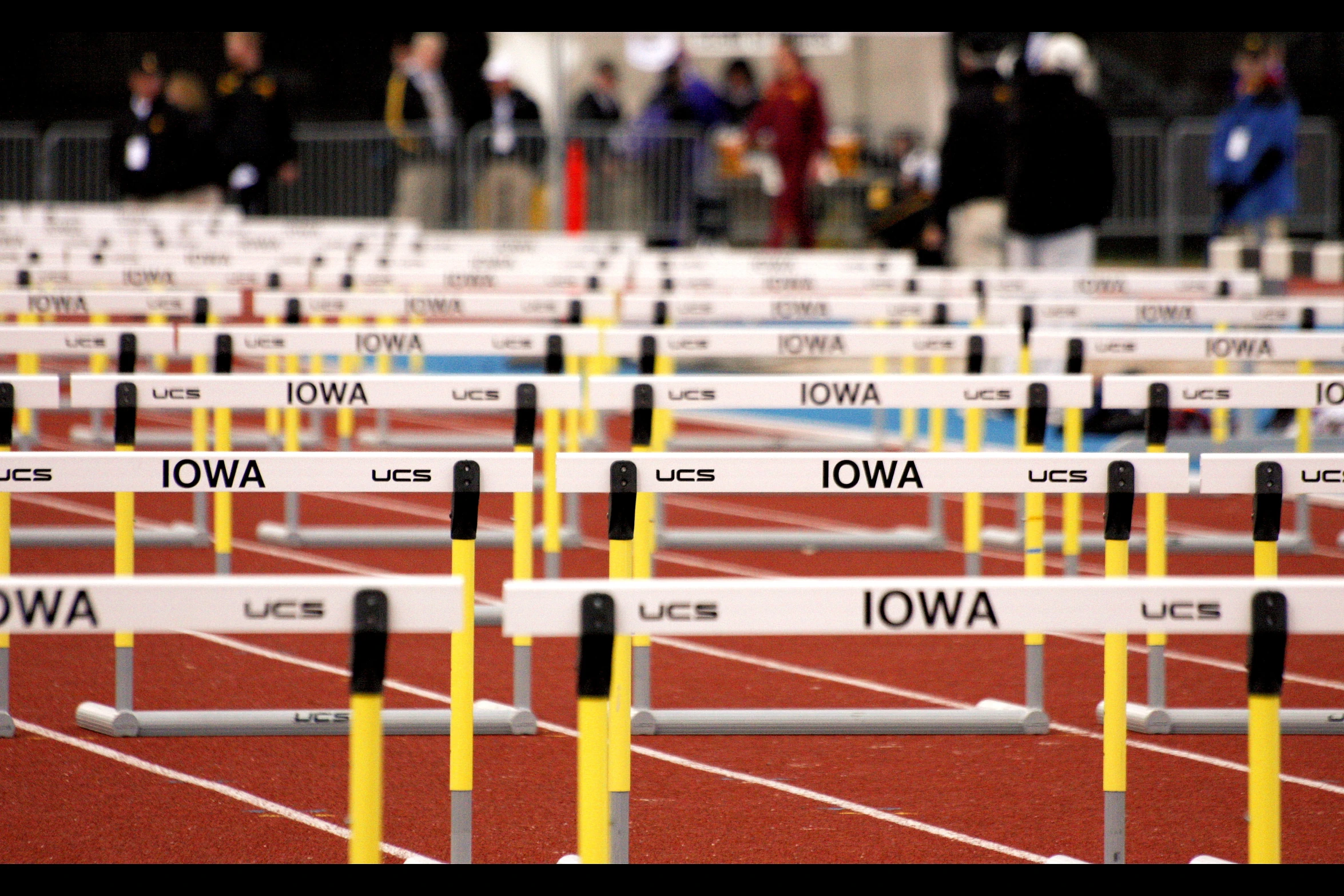 rows of white poles with black and yellow ends