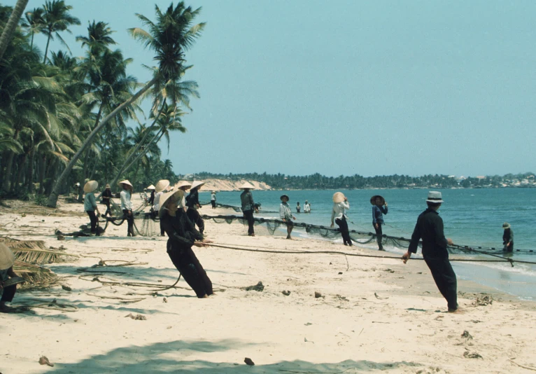 there is an ocean with people standing on the beach and water