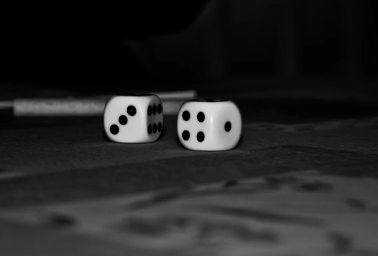 two dices sitting on top of a table
