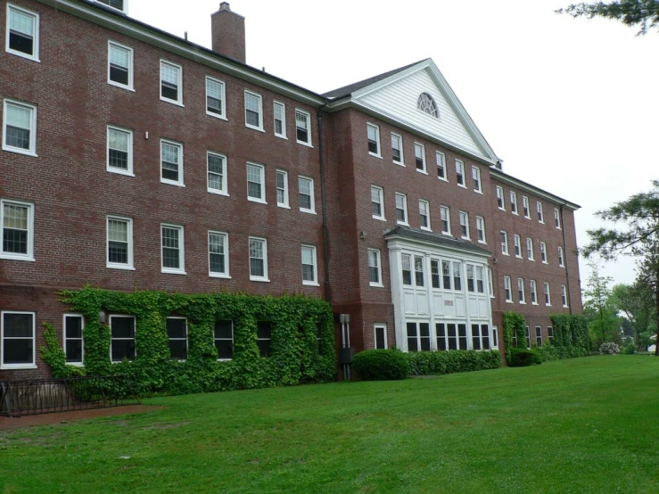 a large brick building with a clock on top