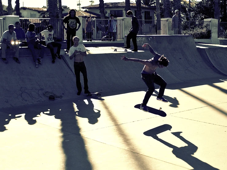 a skateboarder is doing tricks on a ramp