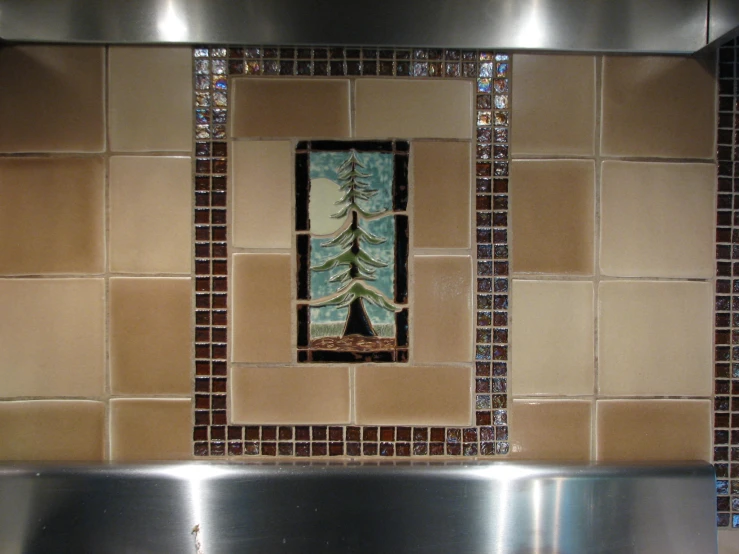 there is a picture with trees on it hanging in the kitchen