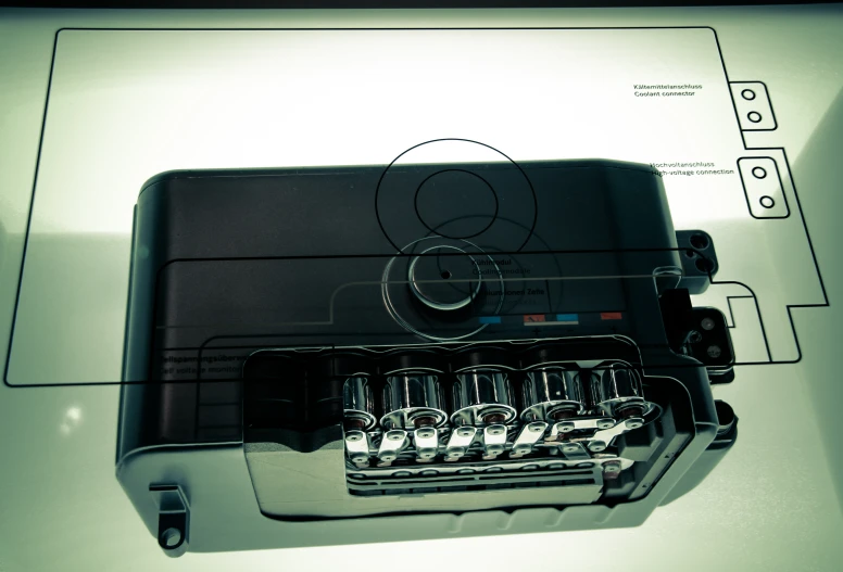 a white table with an electronic type of device