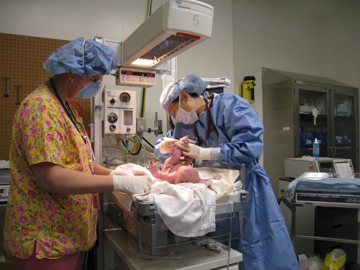 two nurses perform an ivd in the hospital