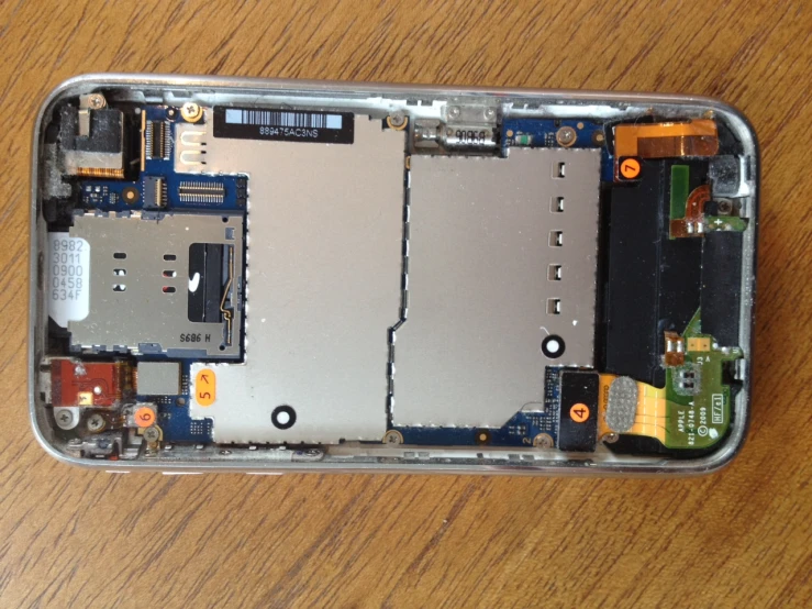 an image of a cell phone being removed from the back case