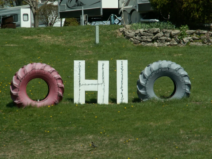 a sign that says ho and another has two tires in it