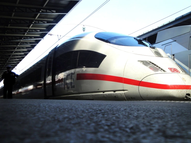 a commuter train parked next to a station