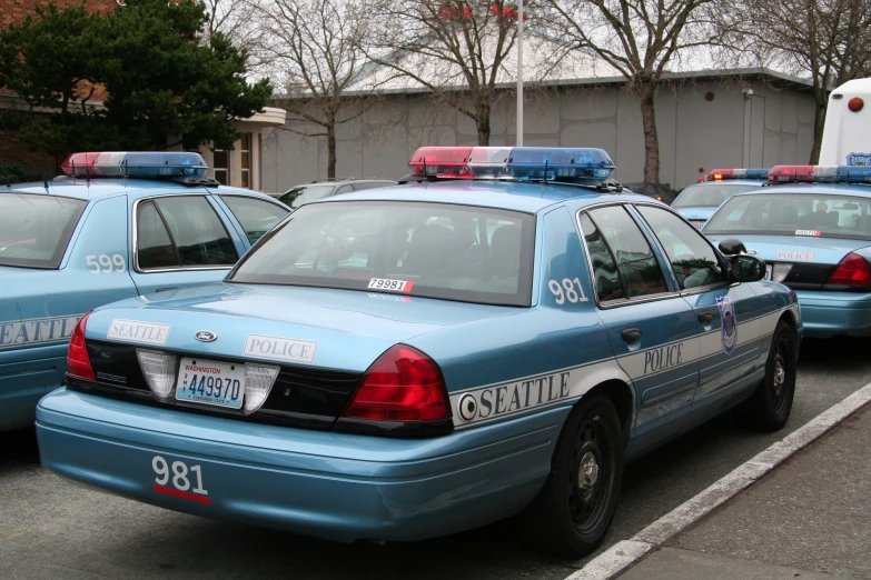 a couple of blue police cars parked in the street