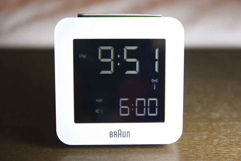 an alarm clock shows the time as 3 46