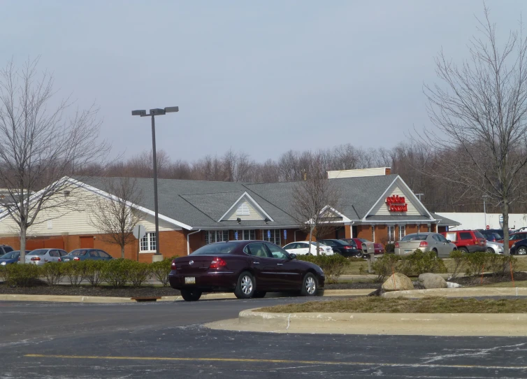 a parking lot with a few cars parked in it