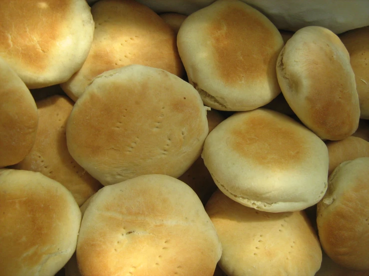 a close up of several bread rolls sitting on top of each other