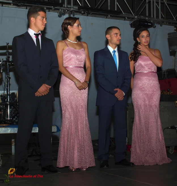 a couple wearing dress while holding hands