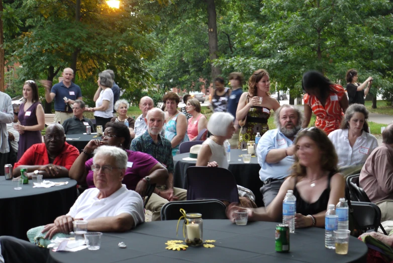 a large group of people sitting at table