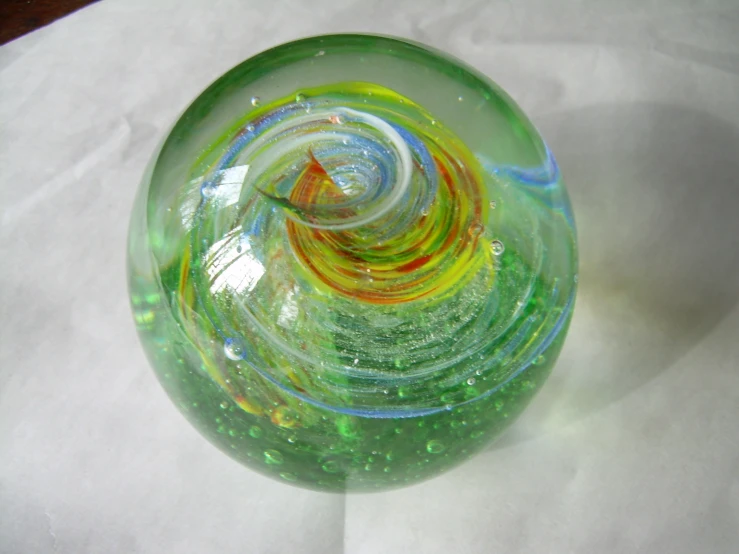 some swirly glass with red, orange, blue, green and yellow colors
