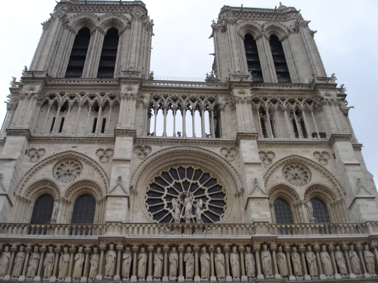 a gothic styled cathedral with a massive clock