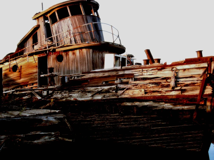 a boat on water near the shore and sky