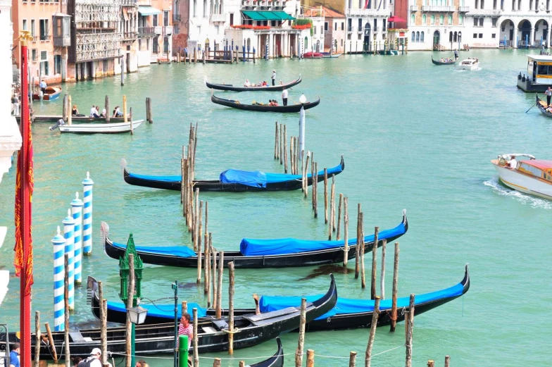 boats parked on the shore near the buildings